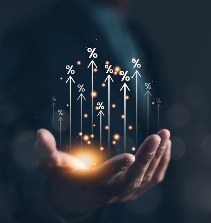 Businessperson holding glowing virtual growth arrows with percentage signs, symbolizing rising interest rates or financial growth metrics